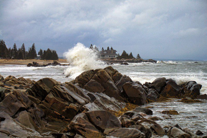 Picture depicting waves hitting rocks in the Bay of Green Bay.