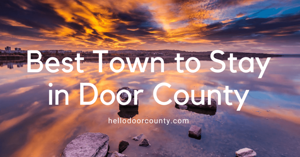 Image depicting a sunset over Door County with the text best town to stay in Door County.