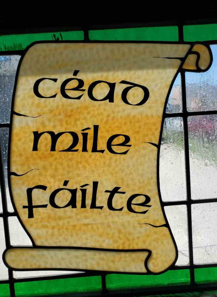 stained glass in kitty o'reilly's in sturgeon bay, Door County, Wisconsin, that reads "cead mile failte."