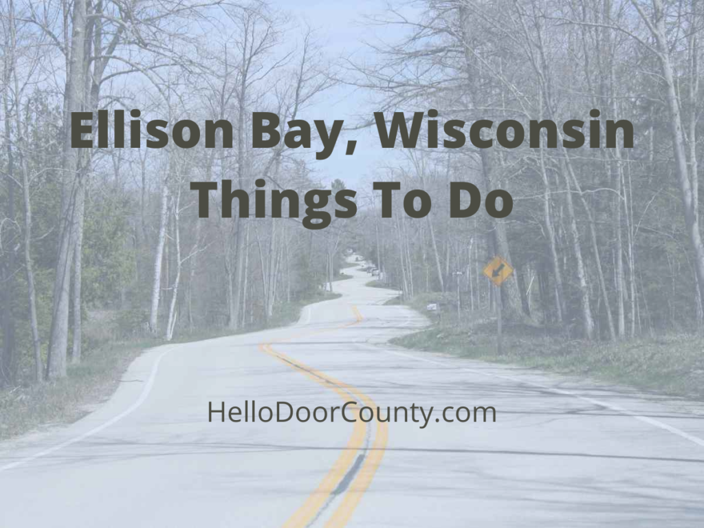 The curvy road in Door County, Wisconsin, with a semi-transparent blue overlay and text in black reading, "Ellison Bay, Wisconsin Things To Do HelloDoorCounty.com"