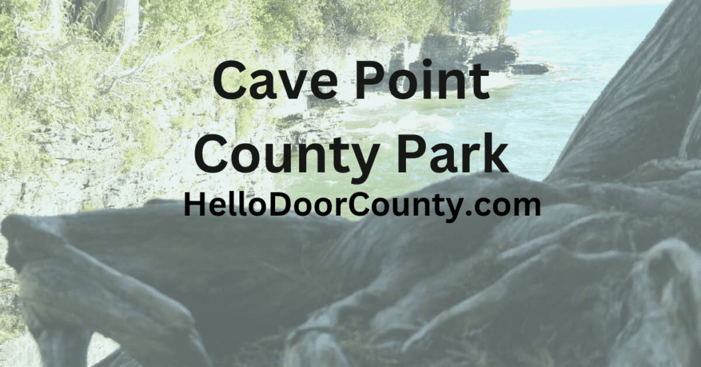 caves in a cliff over Lake Michigan with tree roots in the foreground and the words "Cave Point County Park HelloDoorCounty.com"