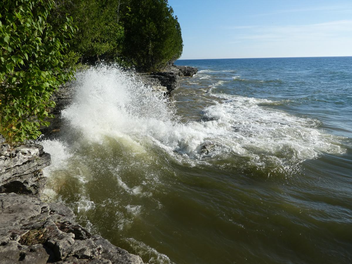 waves crashing into cliffs at Cave Point County Park