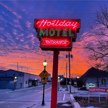 neon sign: Holiday Music Motel