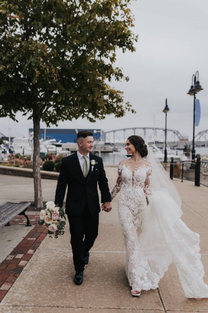bride and groom on waterfront in door county