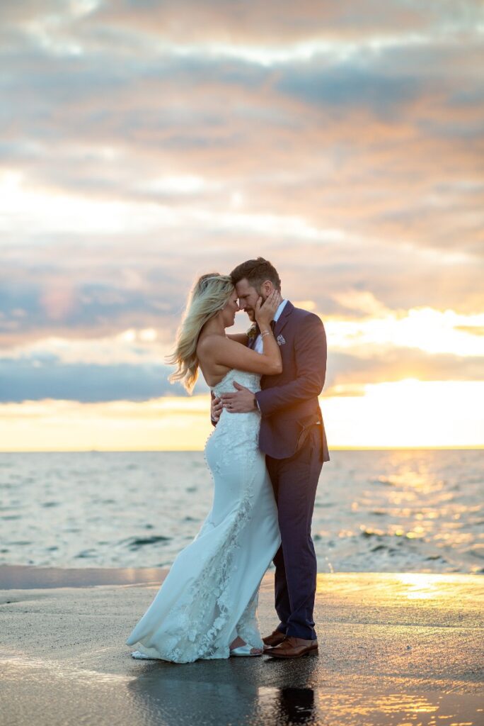 bride and groom on the shore of Lake Michigan in Door County