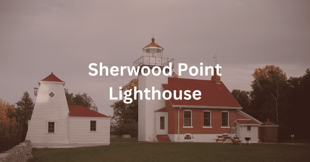 Red brick, one-and-a-half, end-gabled building with a white lighthouse tower and a white outbuilding. Superimposed text says: "Sherwood Point Lighthouse."