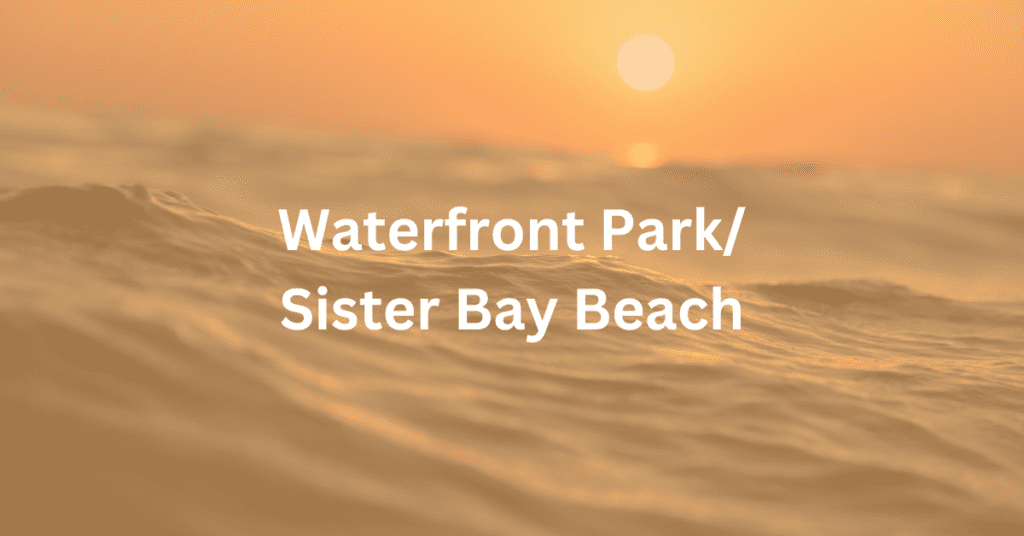 Waves with the sun setting in the background. Superimposed text says: Waterfront Park/Sister Bay Beach.