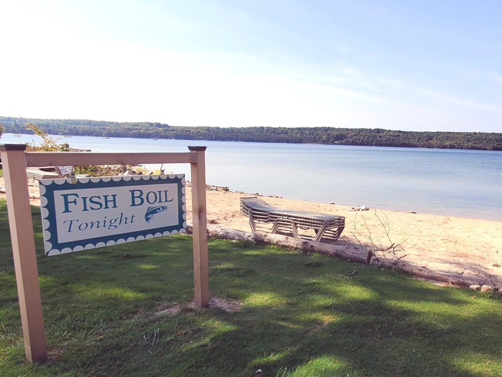 sign advertising a fish boil along the bay of Green Bay in Ephraim, WI