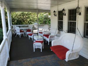 Porch swing, porch furniture at High Point Inn