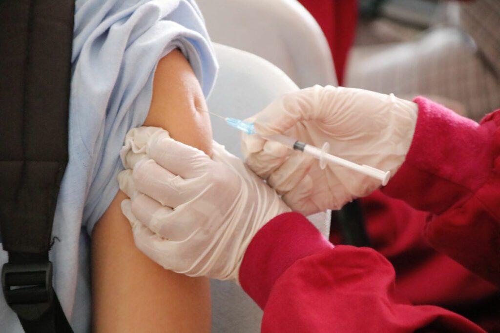 person being vaccinated in the arm