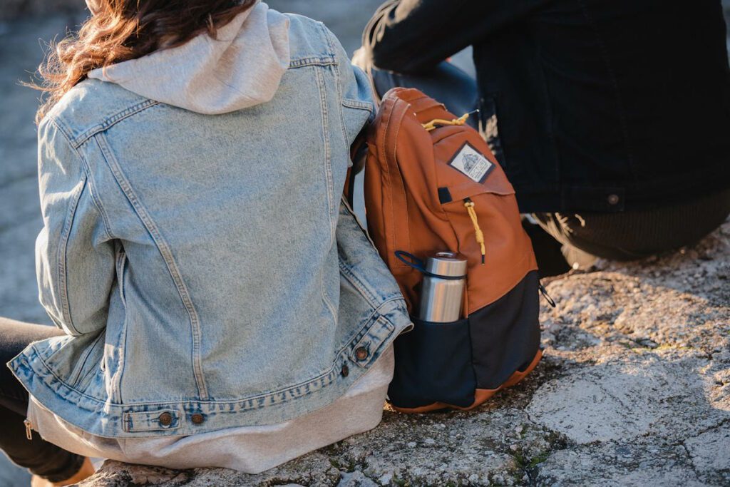 backpack on woman with water bottle in it