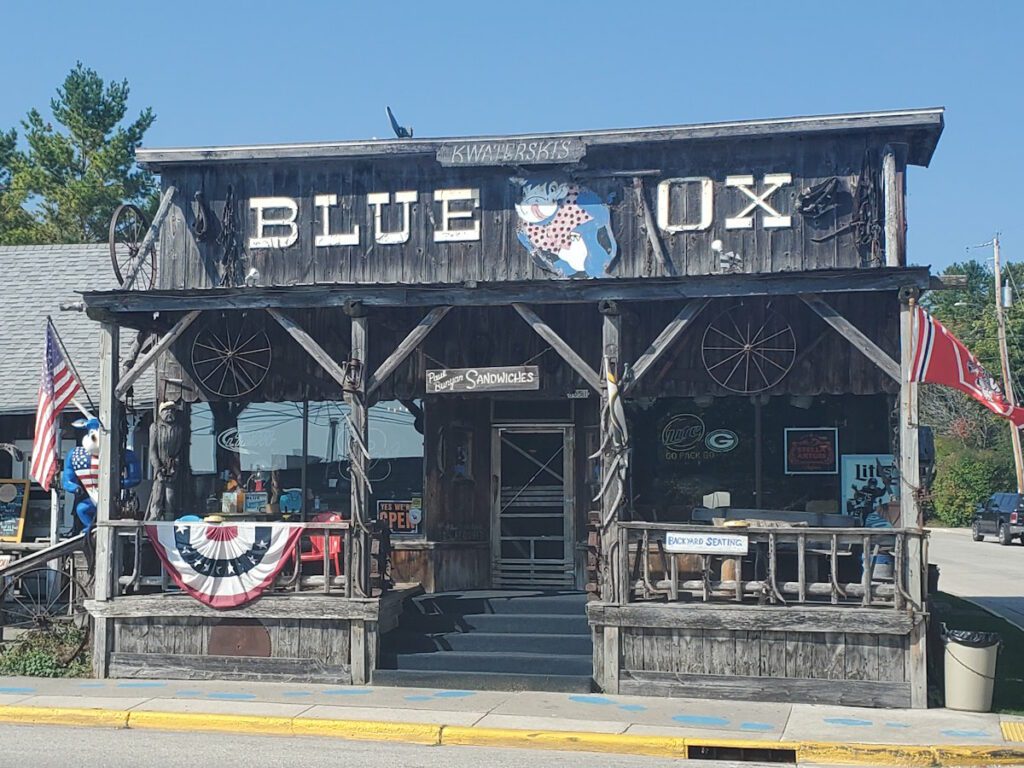 front of a rustic bar - Blue Ox