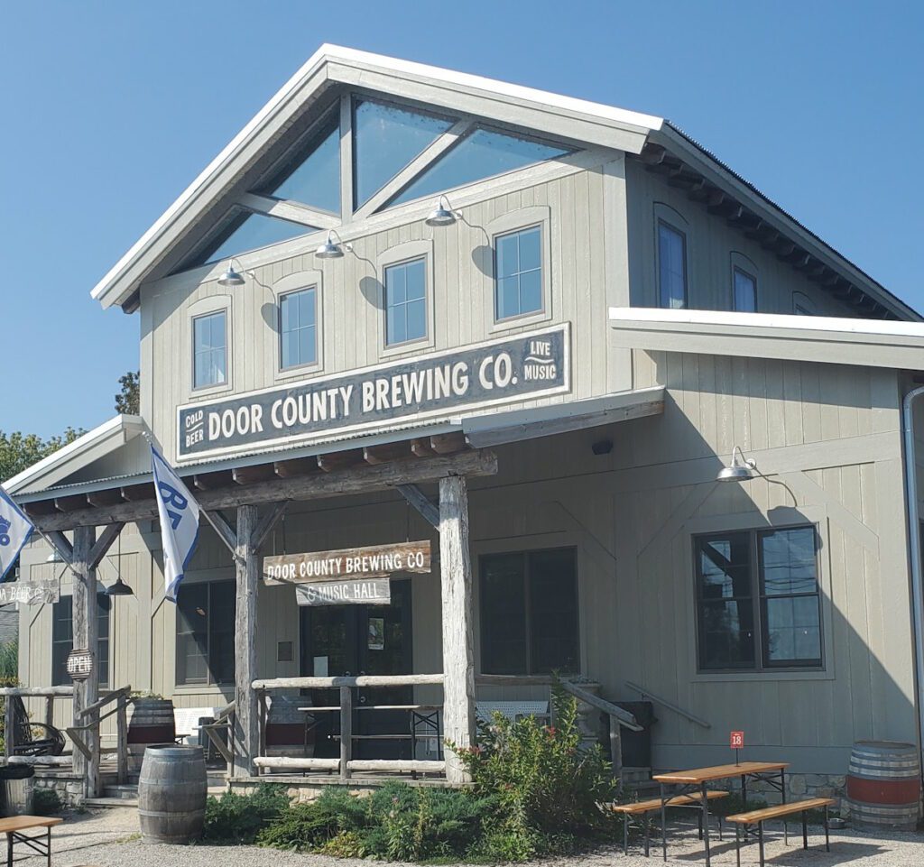 exterior of two story siding building - Door County Brewery