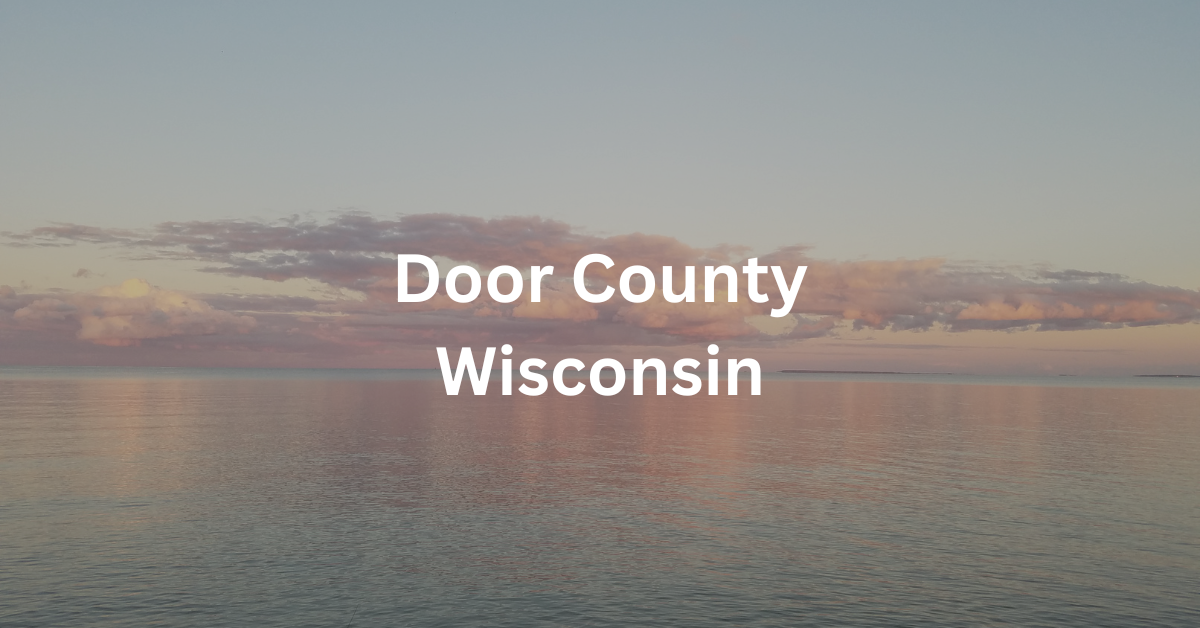 Sunset over the bay of Green Bay. Superimposed text says: Door County Wisconsin